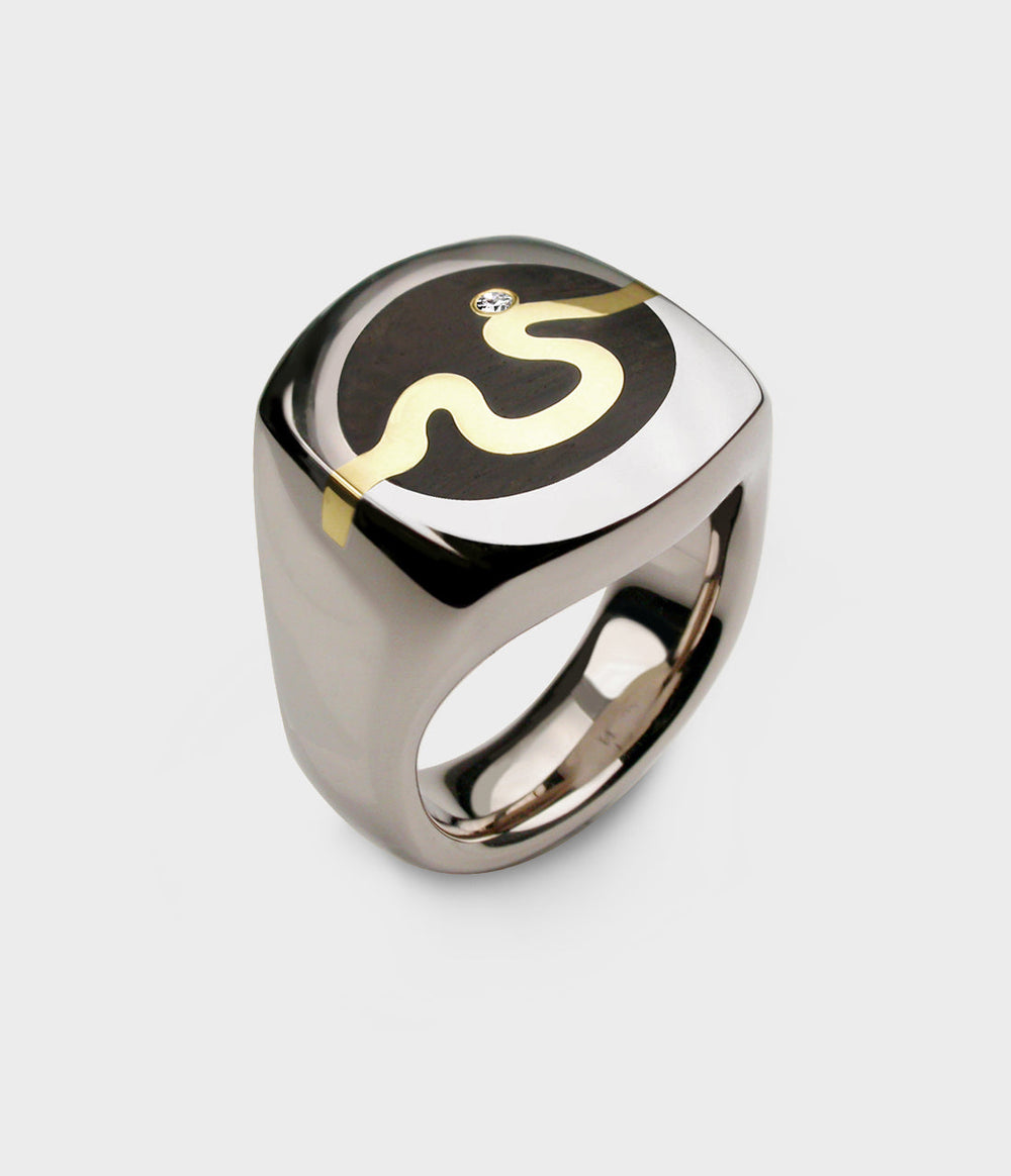 very heavy white gold signet ring inlaid with thames wood with a yellow gold river and a diamond inlaid into the wood.
