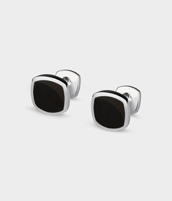 a close up of silver Inlaid Signet Cufflinks with onyx