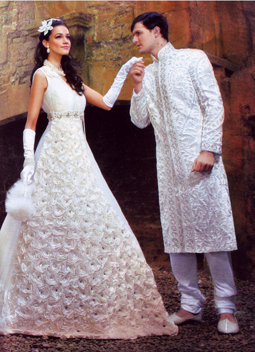 Bride and groom in ivory wedding clothes in Asiana Wedding magazine, the bride in a pearl necklace