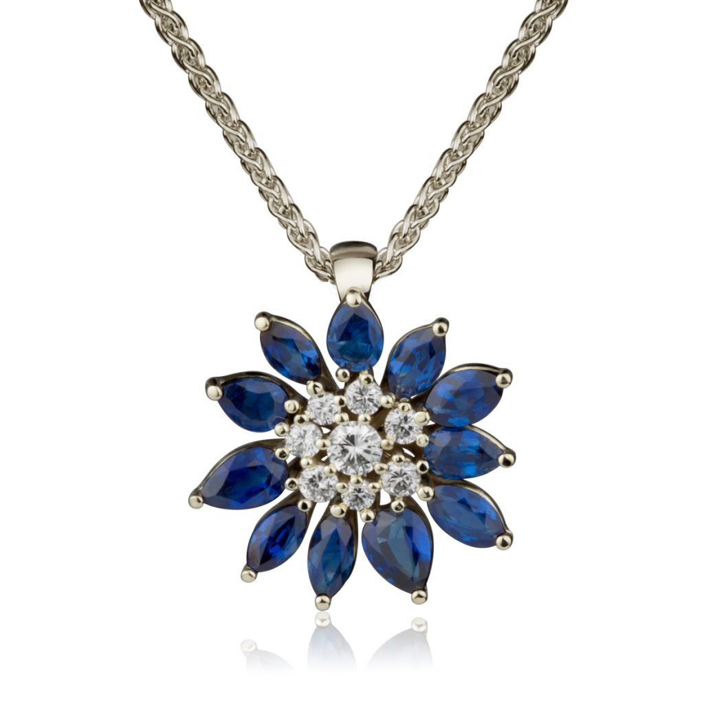 White gold flower pendant with marquise blue sapphire petals around a cluster of white diamonds