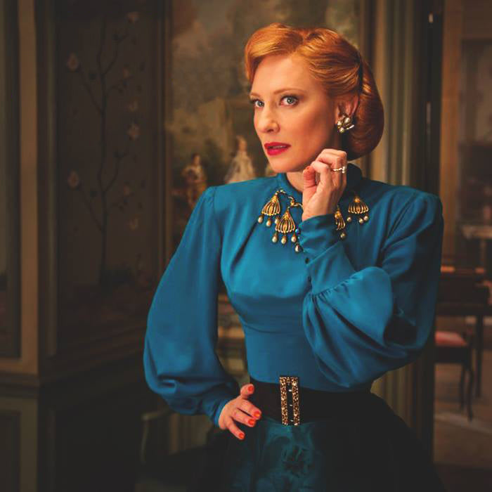 Cate Blanchett as the stepmother in Cinderella, in a teal dress, wearing our bespoke ring
