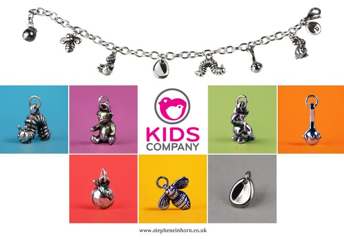 Silver charm bracelet and charms for Kids Company, including a bee, teddy bear, caterpillar and rattle