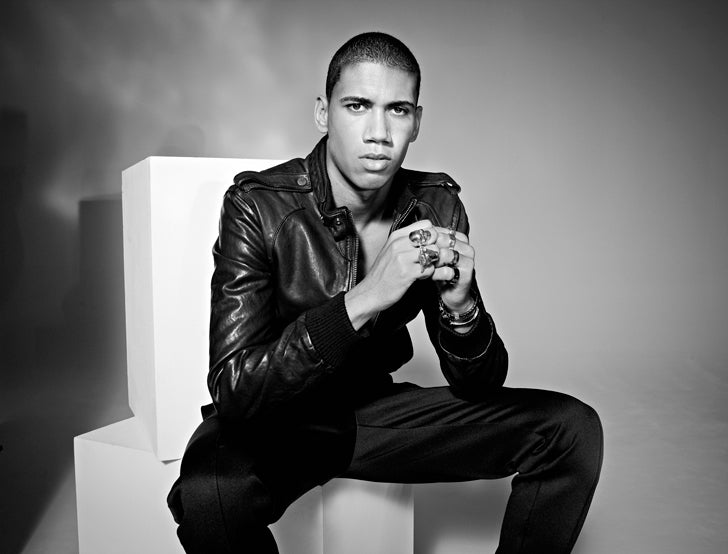 Chris Smalling in a leather jacket wearing several silver rings and a bracelet, black and white portrait