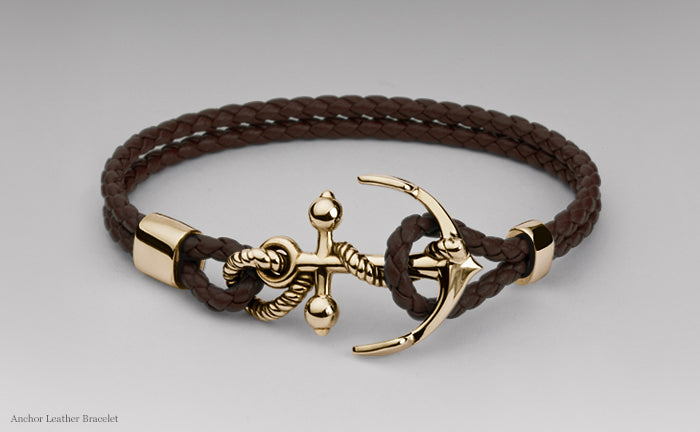 Anchor bracelet in yellow gold on a double strand of plaited brown leather