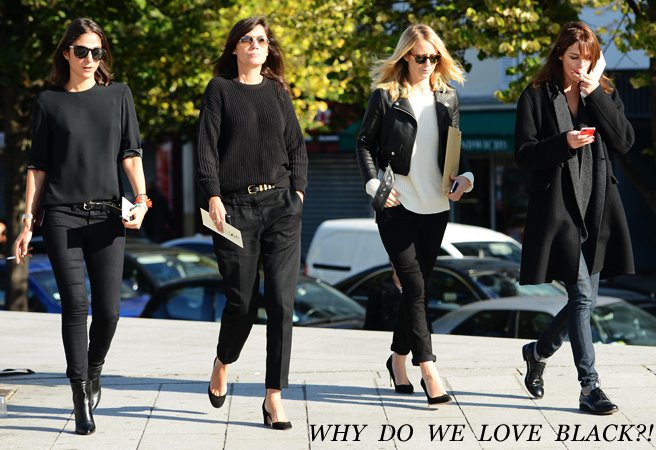 Four women in black outfits and sunglasses walking along a street, captioned Why do we love black?!