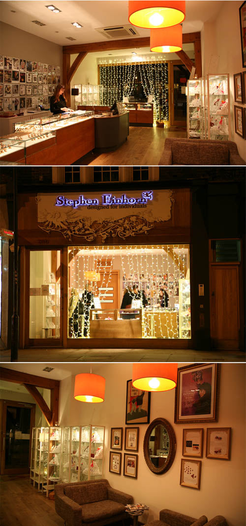 Stephen Einhorn shop at night with fairy lights in the window, glass counters and a seating area inside