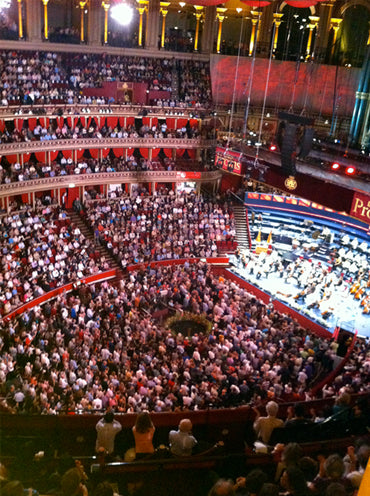 Packed Royal Albert Hall seen from the upper tiers during a Proms concert, orchestra on stage