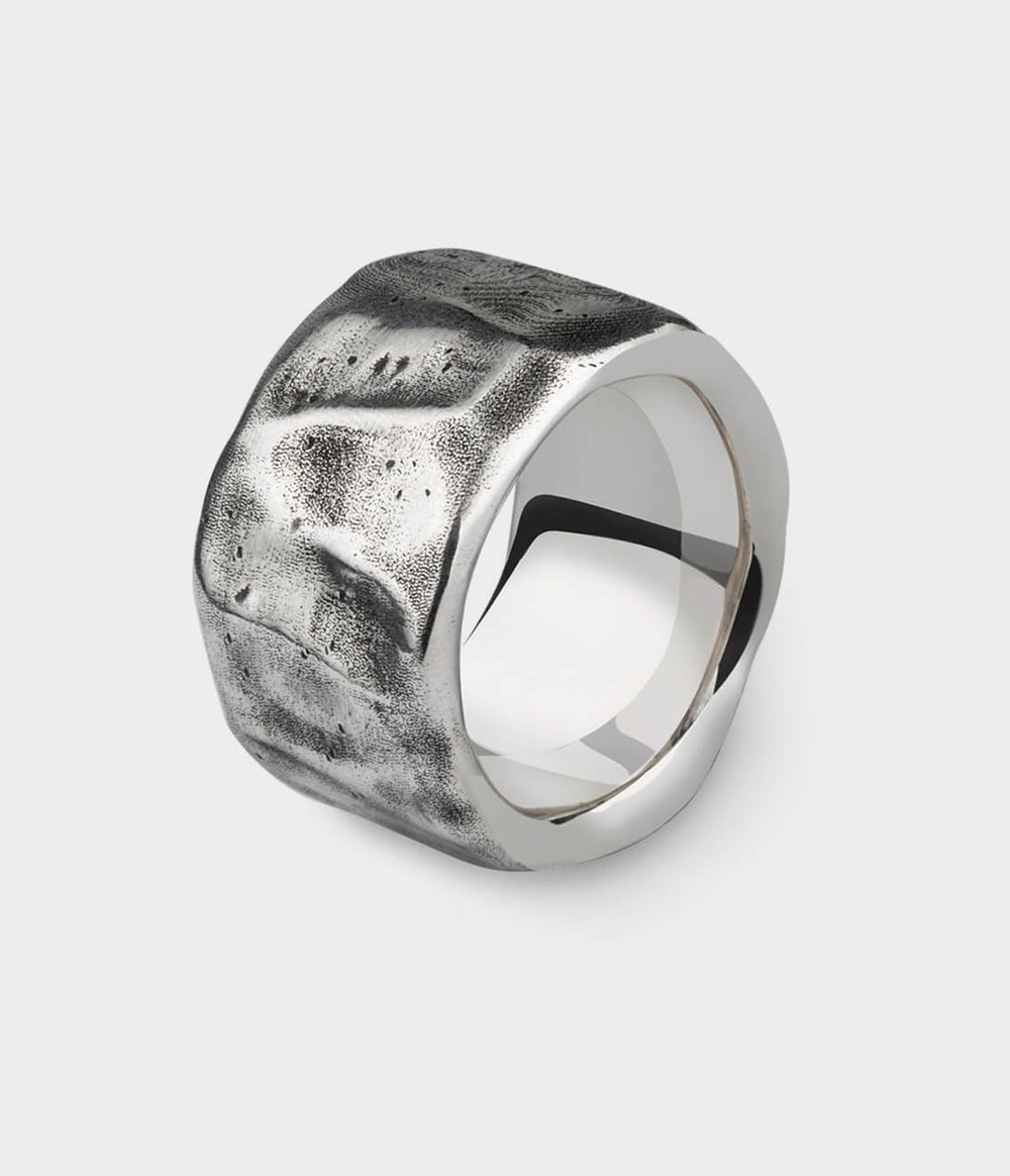 a close up of a silver Beaten Extra Wide Ring