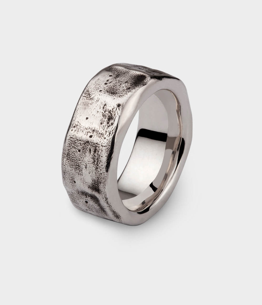  a side view of our beaten ring in white gold