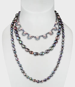 Peacock and pink pearl triple strand necklace from the Coco collection.