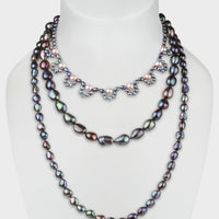 Peacock and pink pearl triple strand necklace from the Coco collection.