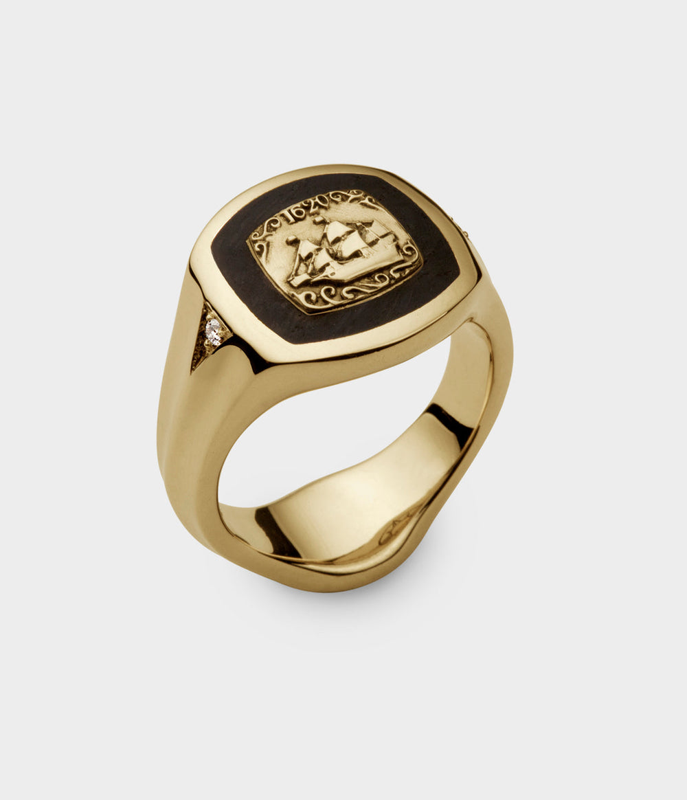 solid gold signet ring with an image of the Mayflower in gold inlaid in Thames Wood.