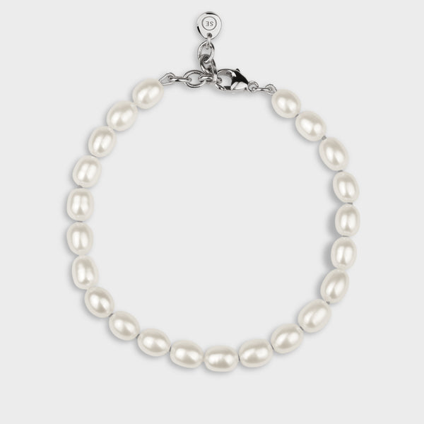 Irregular shaped ‘rice’ white pearl bracelet with silver clasp.