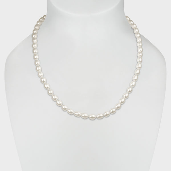 Irregular shaped ‘rice’ white pearl necklace with silver clasp.