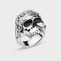 Silver oak leaves and acorns skull ring on a light grey background