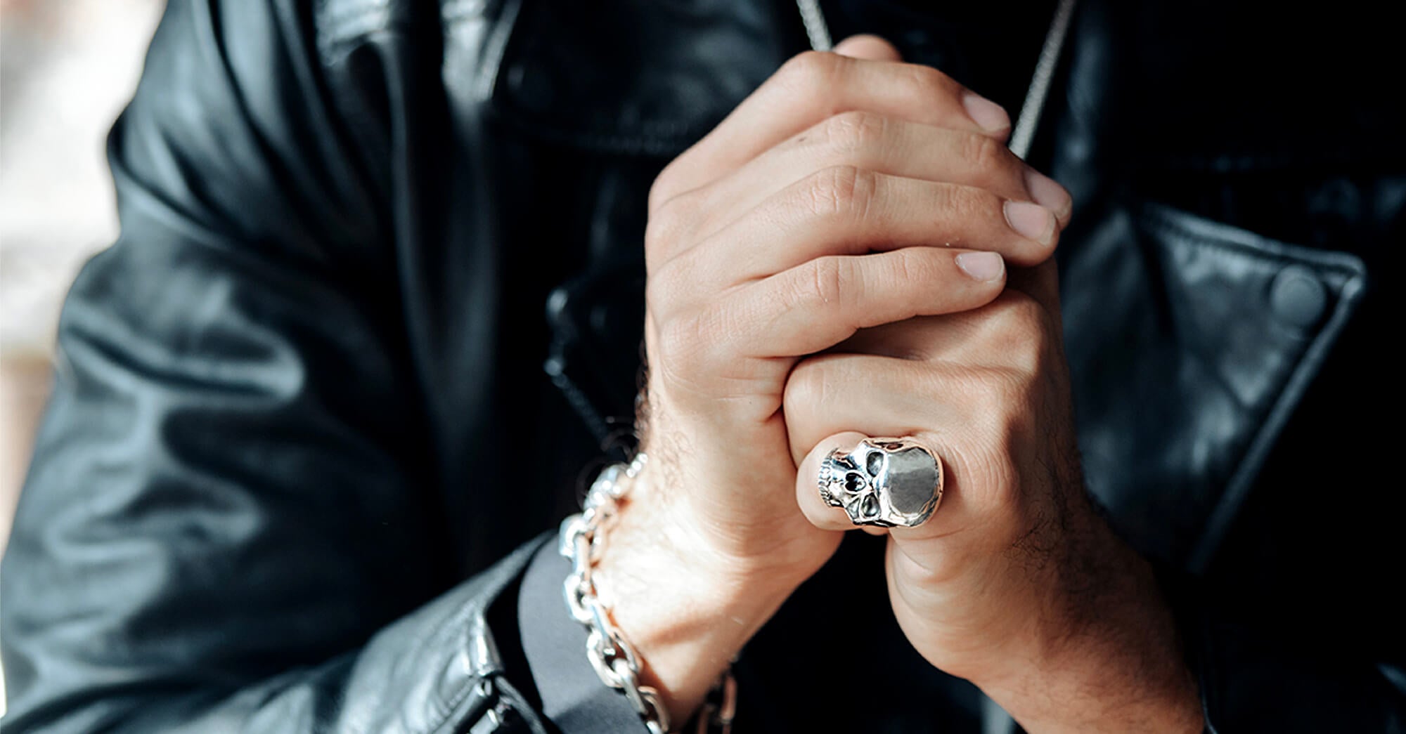 Man in leather jacket wearing a silver large skull ring