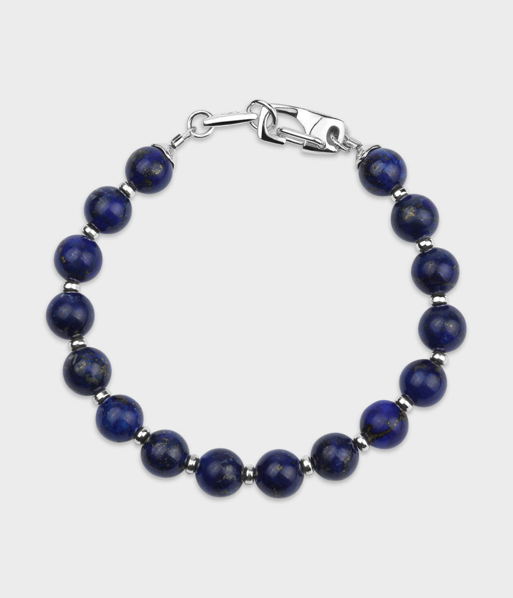 Silver and round lapis stone Trust bracelet.