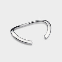 profile of a wavy silver elipse bangle