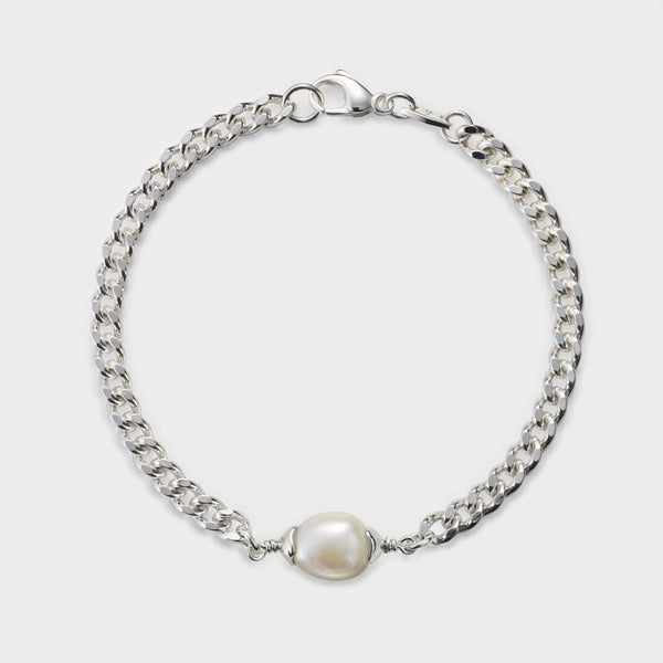 an overview of a chain and baroque pearl bracelet with a white pearl
