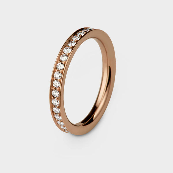 3/4 view of a rose gold glimmer of light eternity ring set with diamonds