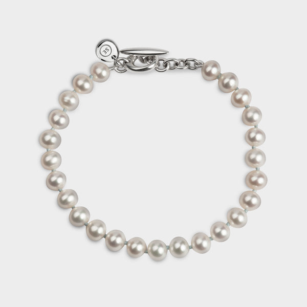 above profile of a single strand white pearl hope braclet.