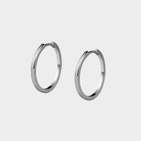 profile view of a pair of large micro mini earrings.