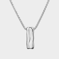 close up of a sliver Liquid necklace on a chain.