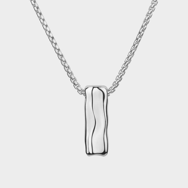 close up of a sliver Liquid necklace on a chain.