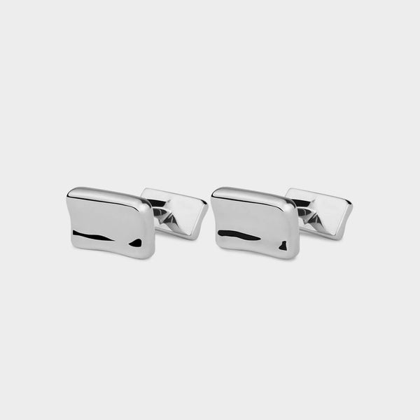 Push through silver cufflink with  rectangular rippled front and back