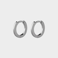 a close up of platinum mini small hoops