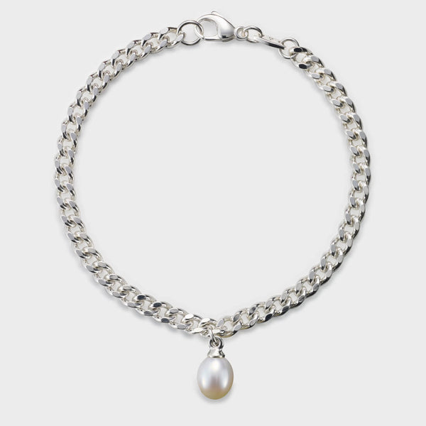 a silver curb chain braclet seen in the round with a drop pearl.