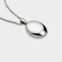 ariel view of a silver Oval Touch Locket