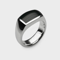 close up of A silver and black onyx signet ring