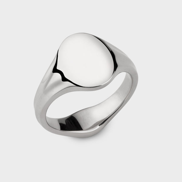 a small solid silver oval signet ring.