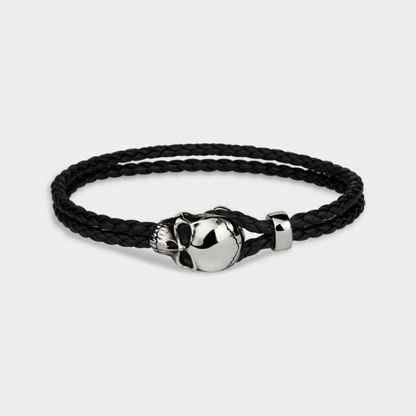 A black skull leather noose bracelet shown in close up.