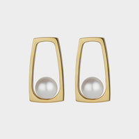 front view of a yellow gold pair of souths sea pearl earrings.